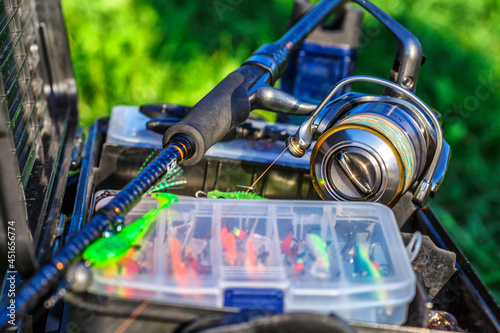 A large fisherman's tackle box fully stocked with lures and gear for fishing.fishing lures and accessories in the box background.