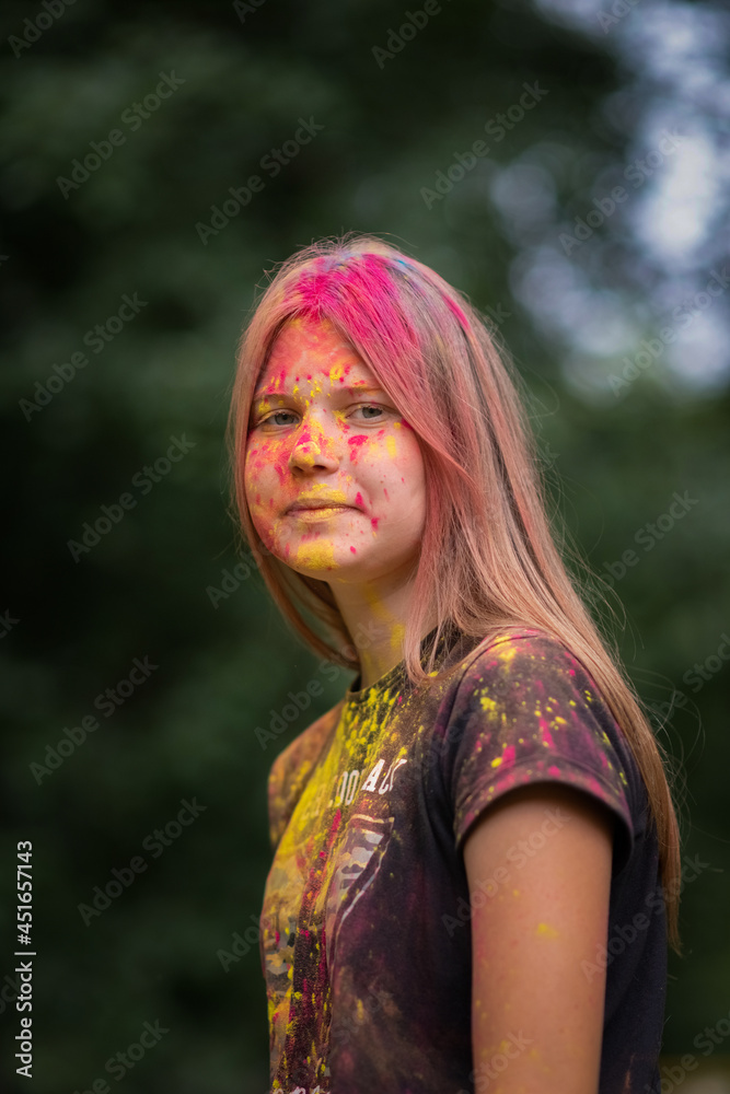 Portrait of a beautiful girl with long hair in holly paints. Portrait of a beautiful girl with long hair in holly paints.