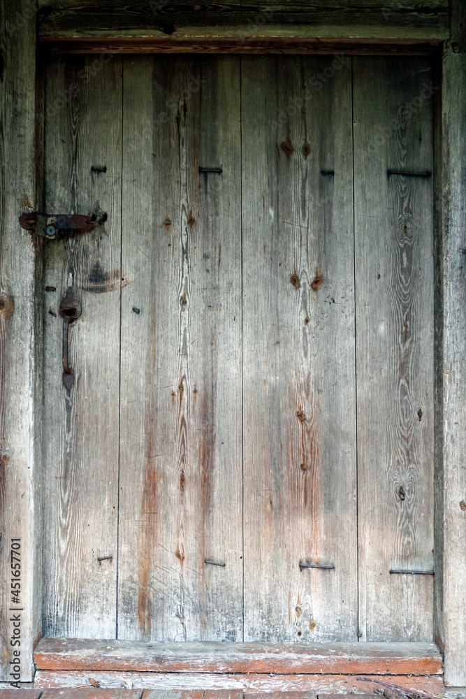 Texture. Background. A door to a rural house in the village. Natural materials. Knocked down by nails Texture. Background. A door to a rural house in the village. Natural materials. Knocked down by nails