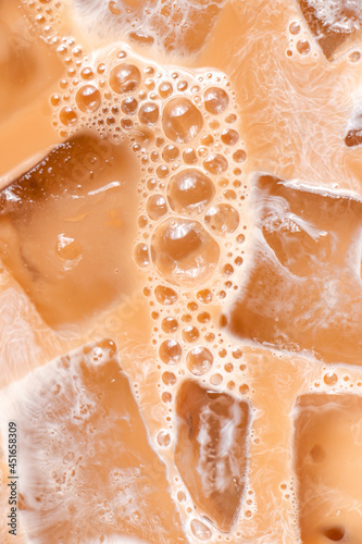 Close up of iced coffee with cream and bubbles