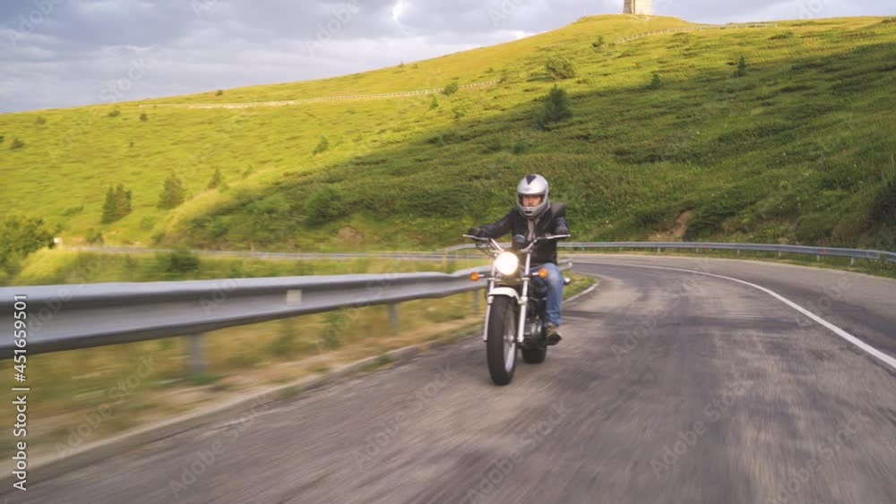 Man Riding Motorcycle In Asphalt Road Curve With Rural Man Riding Motorcycle In Asphalt Road Curve With Rural