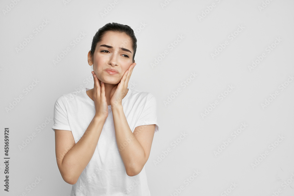 woman with toothache in white t-shirt dissatisfaction health problems woman with toothache in white t-shirt dissatisfaction health problems