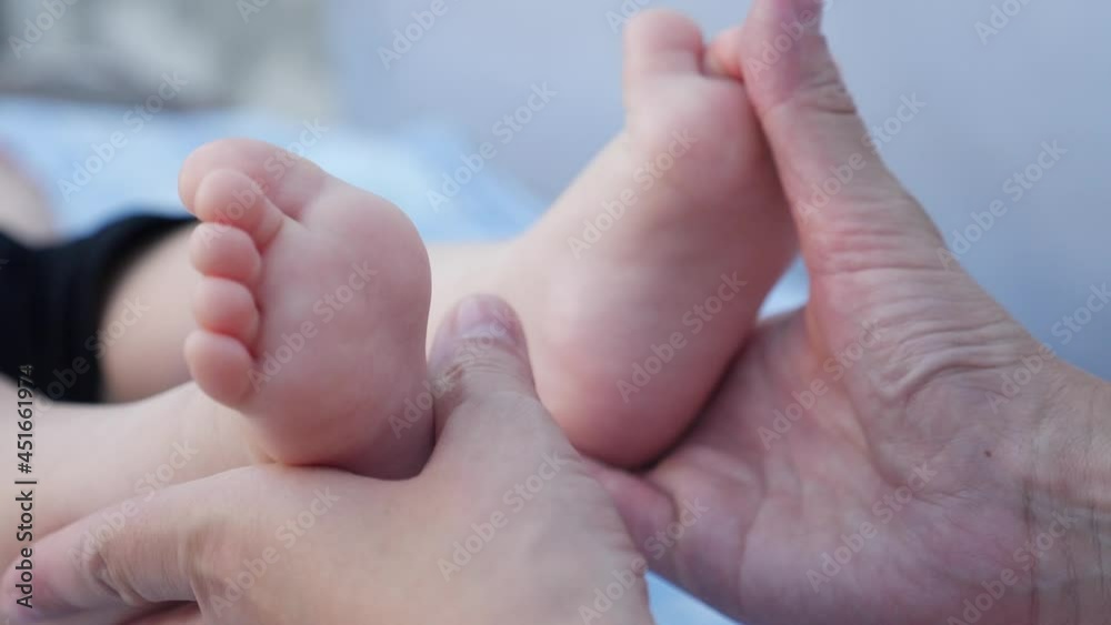 legs feet baby face model a portrait. concept kid dream happy family massage care. close up legs feet little boy baby love. mom holds baby in her arms dream legs feet baby face model a portrait. concept kid dream happy family massage care. close up legs feet little boy baby love. mom holds baby in her arms dream