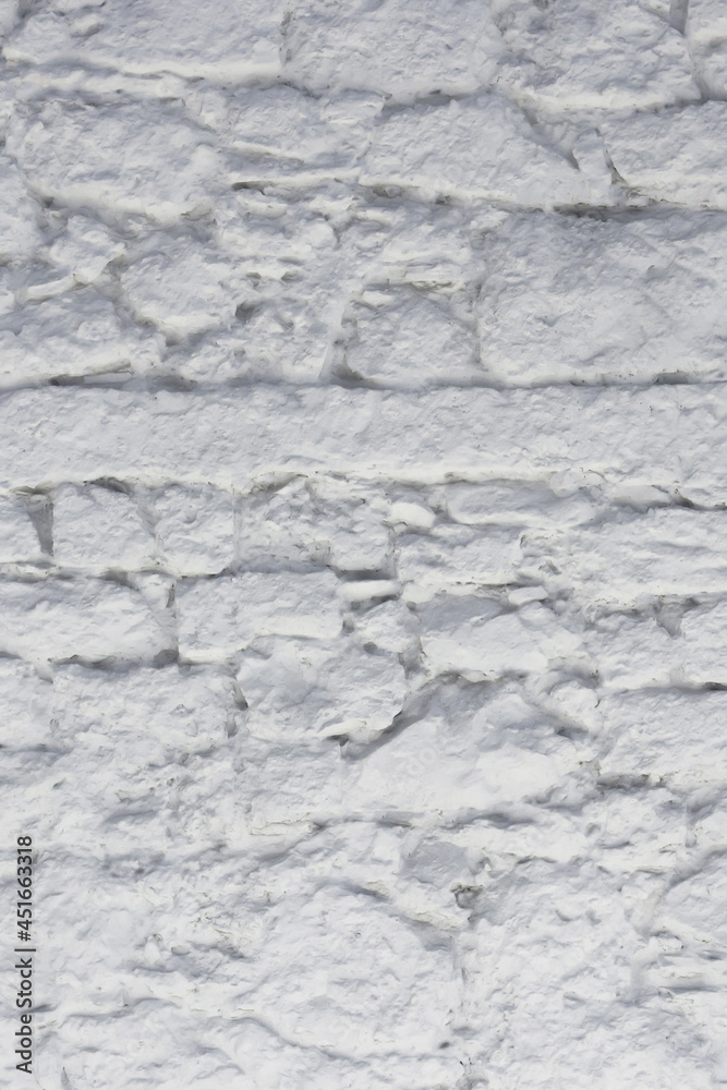 Fragment of the wall from natural stone painted with lime Fragment of the wall from natural stone painted with lime