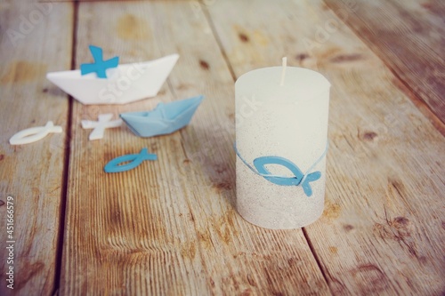 Candle with fish as a symbo...