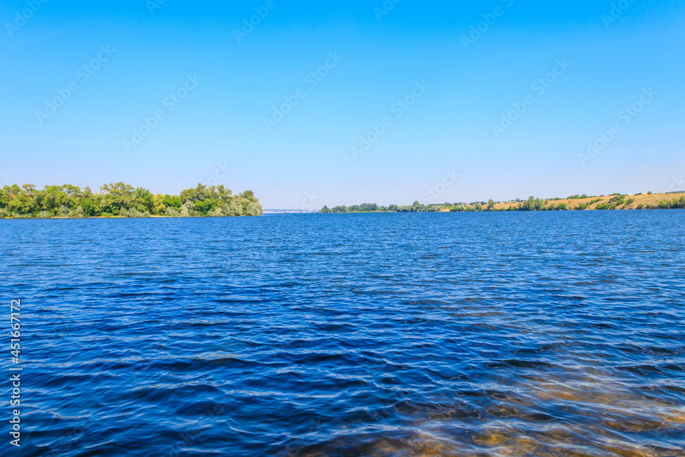 Summer landscape with beautiful river, green trees and blue sky Summer landscape with beautiful river, green trees and blue sky