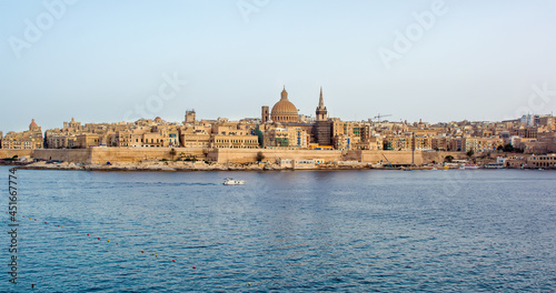Coastal landscape of Valletta at sunny summer day. Maltese Valletta skyline with church of Our Lady of Mount Carmel and St Paul s Pro-Cathedral.