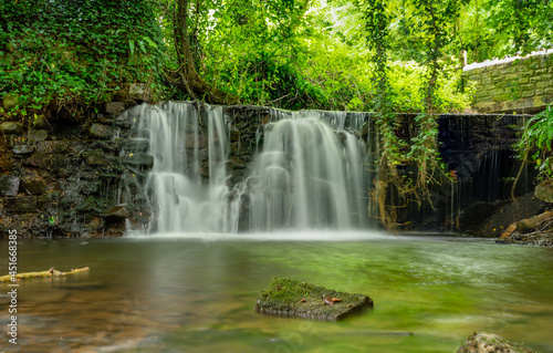 Stream flowing over a historic weir