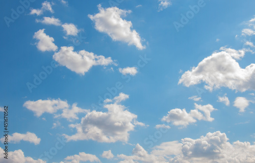 Blue sky background with white small air clouds