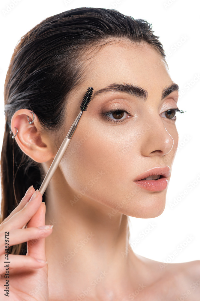 brunette young woman styling eyebrow isolated on white brunette young woman styling eyebrow isolated on white