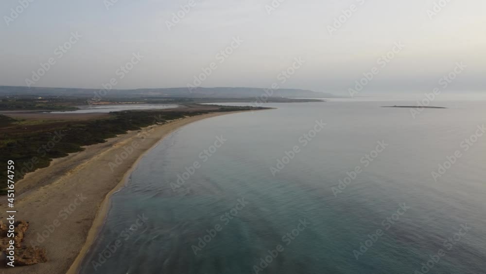 view of the sea - Aerial drone view of a beautiful summer sand beach and tropical sea at sunrise, summer vacation concept, Vendicari, Sicily, Italy view of the sea - Aerial drone view of a beautiful summer sand beach and tropical sea at sunrise, summer vacation concept, Vendicari, Sicily, Italy