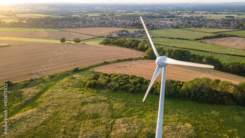 Lonely wind turbine in farm fields, East Sussex, UK.