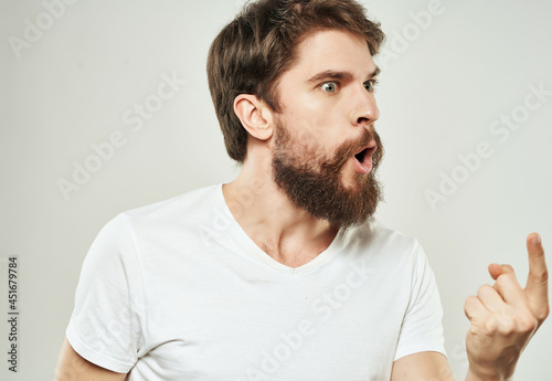 bearded man in a white t-shirt expressive look discontent Lifestyle