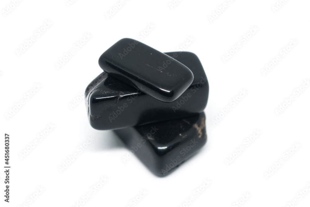 Azabache black ore isolated on pure white background. Black stones jet, agate, shungite. Azabache black ore isolated on pure white background. Black stones jet, agate, shungite.