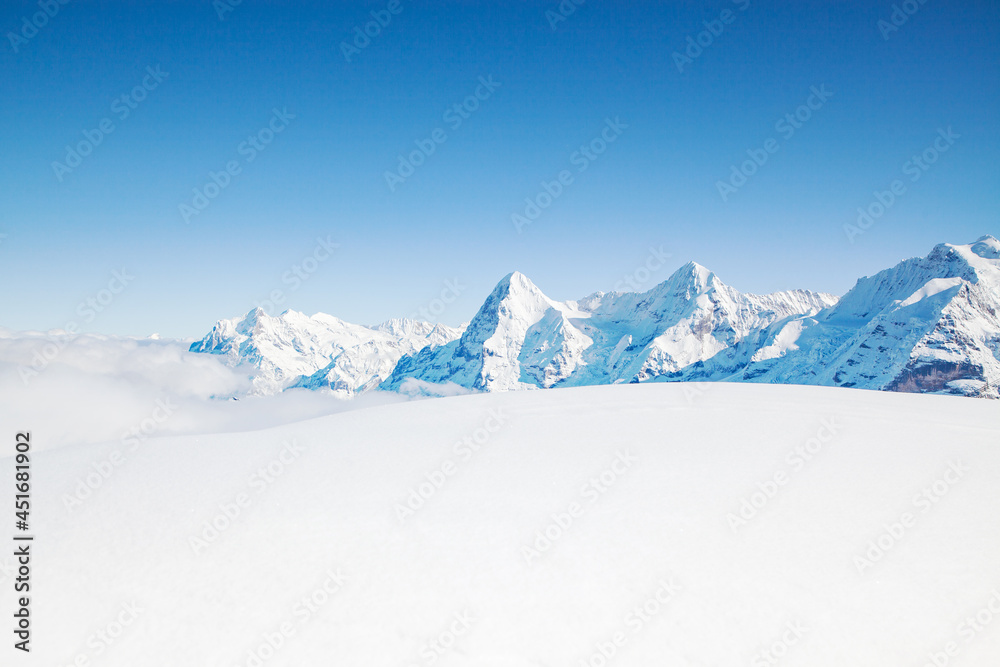 white winter background with snowy peaks in the Swiss Alps