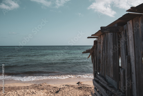 Fisherman's house on Migjorn beach in Formentera, Spain in summer photo
