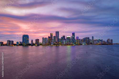 City of Miami Florida, sunset panorama with business and residential buildings and bridge on Biscayne Bay. Skyline night view. © Volodymyr