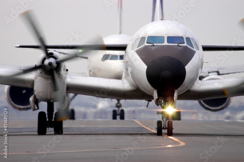 Japanese old propeller airliner YS-11 taxing to runway