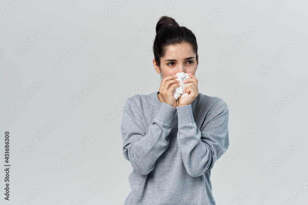 woman with handkerchief runny nose cold infection woman with handkerchief runny nose cold infection