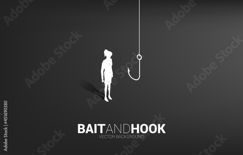 Silhouette of businesswoman standing with fishing hook. Concept of bait and hook in business.