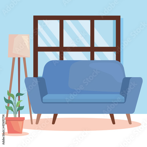 blue sofa and houseplant