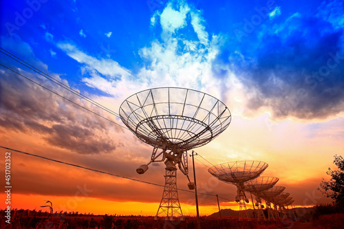 The silhouette of a radio telescope observatory