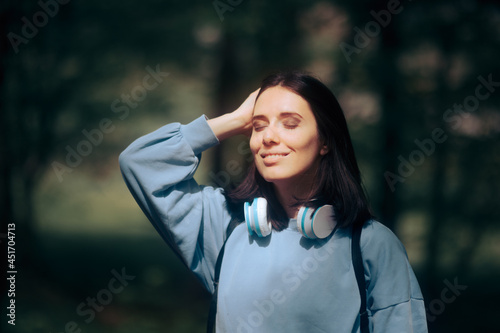 Portrait of a Beautiful Woman Daydreaming in Nature