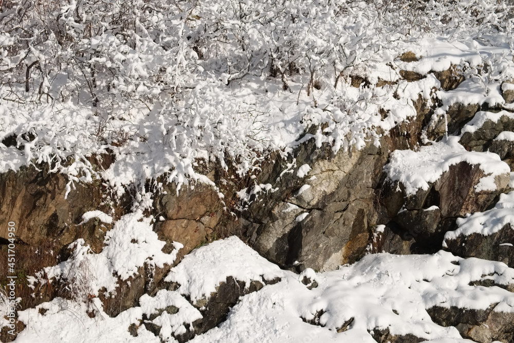 Cliff Outcrop covered in fresh fallen snow Cliff Outcrop covered in fresh fallen snow