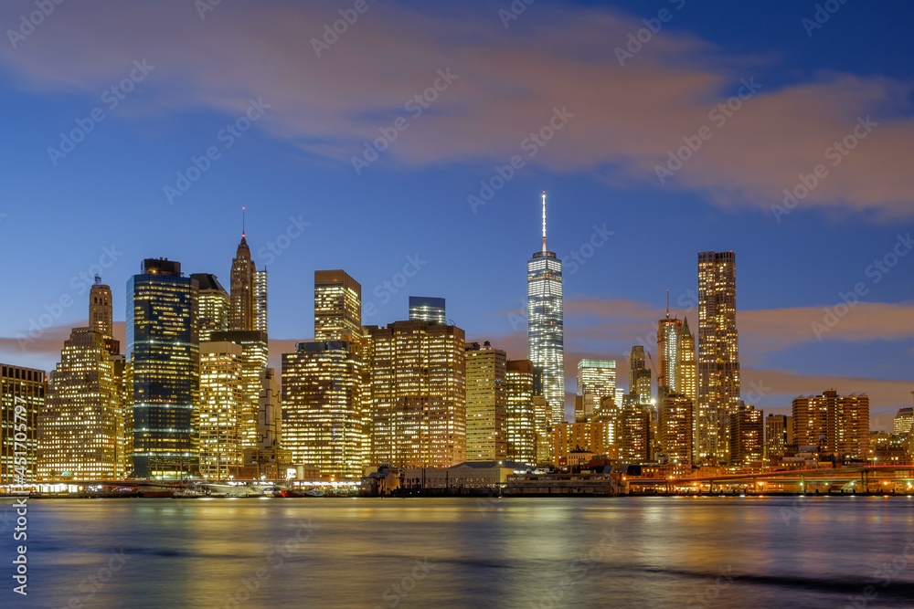 Early winter evening on the New York Skyline as viewed from the East River in Brooklyn showing the lower manhattan and the financial district