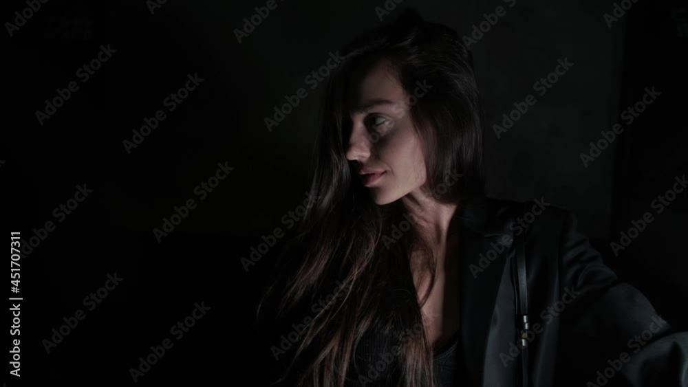 sexy brunette in black on a dark background sexy brunette in black on a dark background