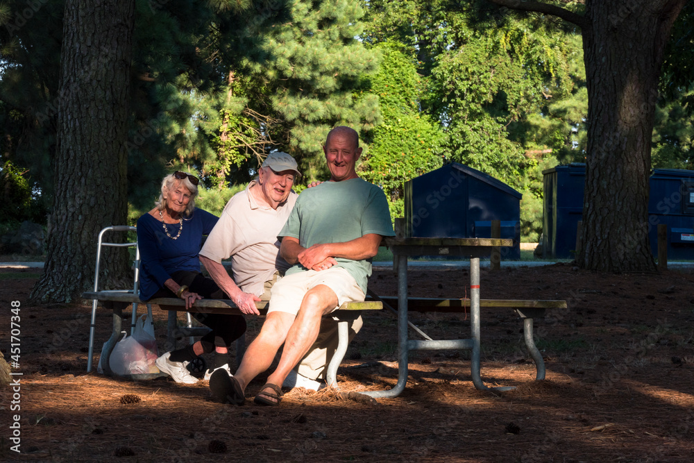 Point Lookout, Maryland, A 90 year old father and son and grandmother on a picnic in the park. Point Lookout, Maryland, A 90 year old father and son and grandmother on a picnic in the park.