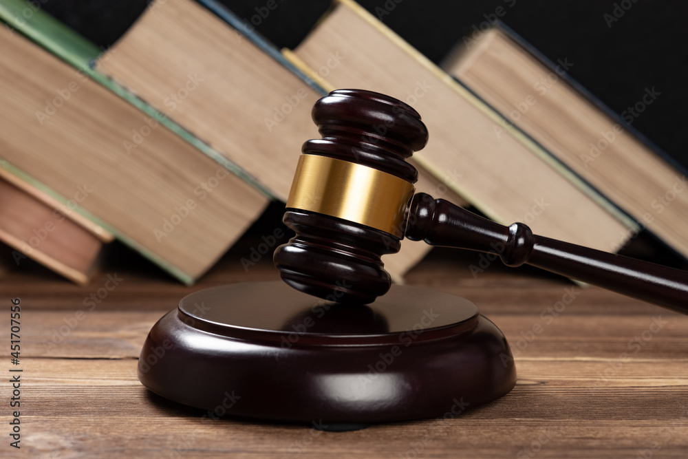 gavel on a table with some books on background gavel on a table with some books on background
