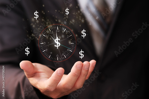 Businessman holding sign clock and business time is money concept, virtual clock with dollar sign for money and time management concept. business growth concept, finance and investment.