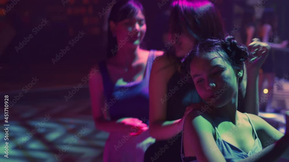 4K Group of Beautiful Asian woman dancing to the music with drinking alcoholic drink on table at night club. Pretty girl friends enjoy and having fun nightlife crazy dance together at nightclub party 4K Group of Beautiful Asian woman dancing to the music with drinking alcoholic drink on table at night club. Pretty girl friends enjoy and having fun nightlife crazy dance together at nightclub party