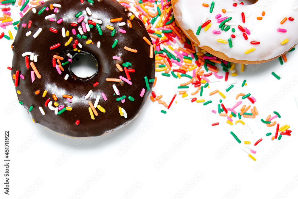 Chocolate, vanilla, and maple frosted donuts with rainbow sprinkles on a white background Chocolate, vanilla, and maple frosted donuts with rainbow sprinkles on a white background