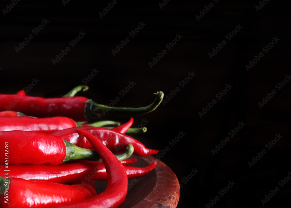 red hot chili peppers on a dark background red hot chili peppers on a dark background