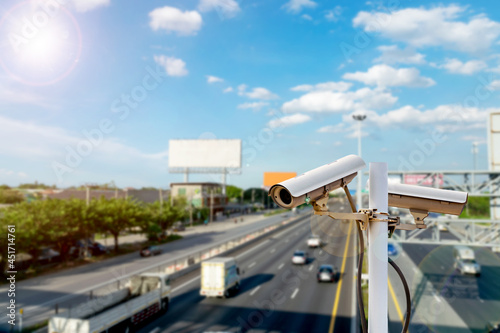 CCTV cameras on the overpass for recording on the road for safety and traffic violations.