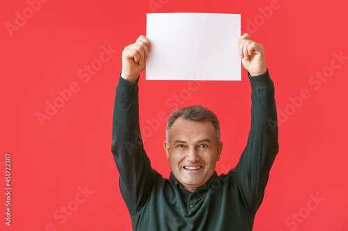 Mature man with blank poste...
