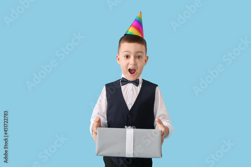 Surprised little boy with p...