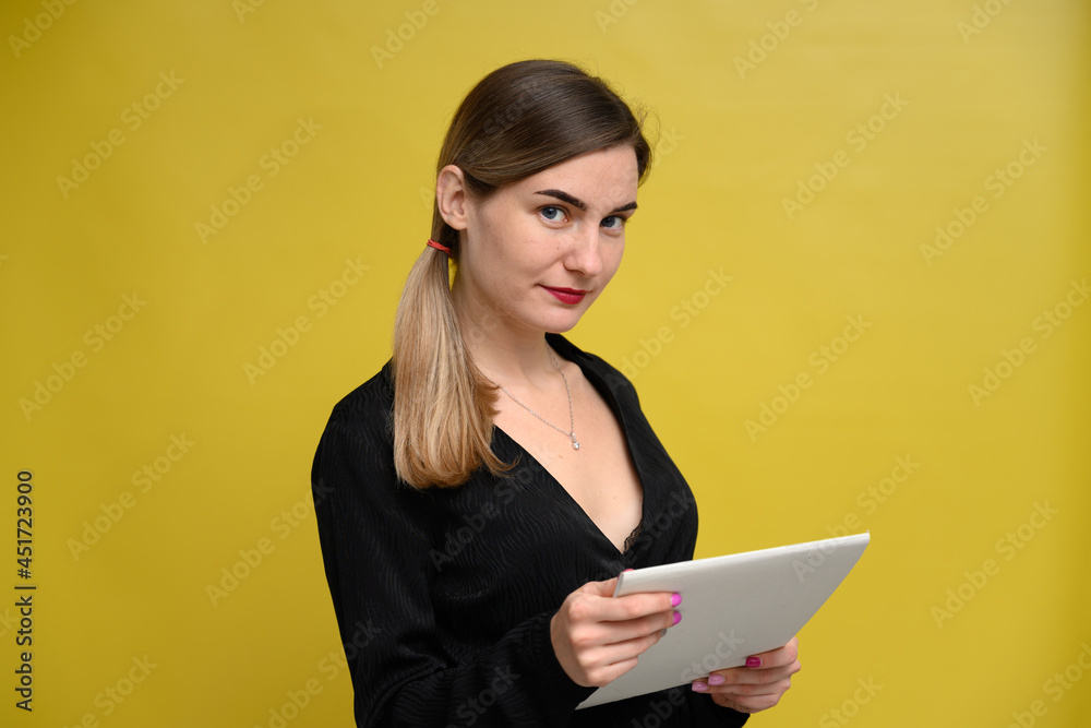 Photo business woman manager with folder with smile stands on yellow background