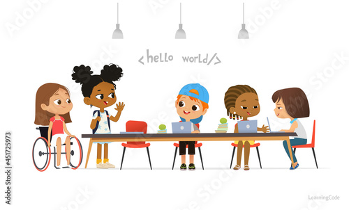Multiracial kids sitting at laptops and learning coding during informatics lesson. Children greeting newcomer girl in a wheelchair. School inclusive education concept. Illustration for website