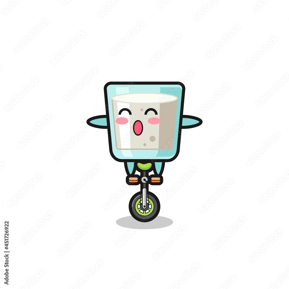 The cute milk character is riding a circus bike The cute milk character is riding a circus bike