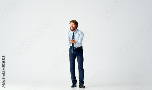 business man in shirt with tie emotions of movement in full growth © SHOTPRIME STUDIO