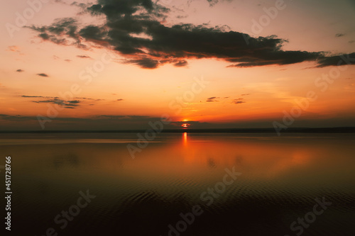 Amazing landscape at sunset. Colorful sunrise on the ocean or sea beach. Colorful nature sea sky