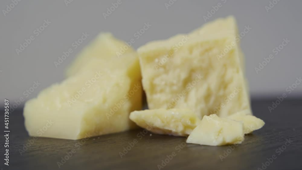 Parmesan cheese composition, on a wooden cutting board. Concept of: italy, cheese and tradition. Parmesan cheese composition, on a wooden cutting board. Concept of: italy, cheese and tradition.
