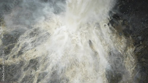 Slow motion top down of gigantic mass of water crashing down the waterfall - 4K Prores High Quality footage