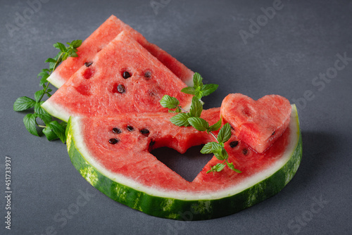 Slices of watermelons on grey table. Сopy space