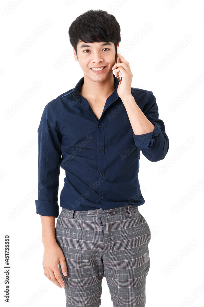 Vertical portrait shot of Asian handsome male with attractive smiling, holding a smartphone with hand and calling to someone while looking at the camera isolated with white background in studio Vertical portrait shot of Asian handsome male with attractive smiling, holding a smartphone with hand and calling to someone while looking at the camera isolated with white background in studio