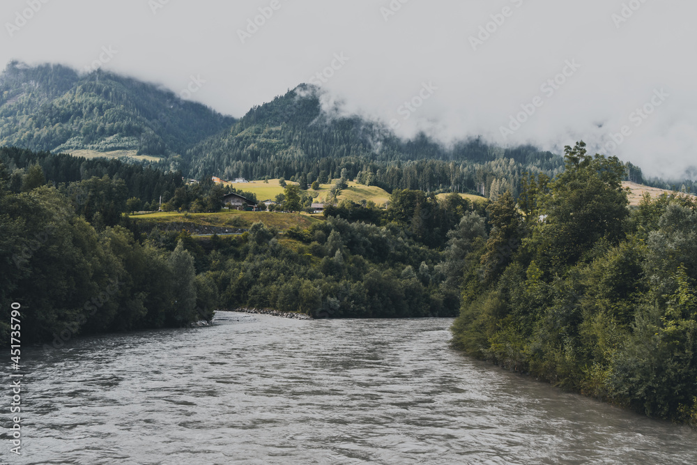 Fototapeta premium river in the mountains with fog
