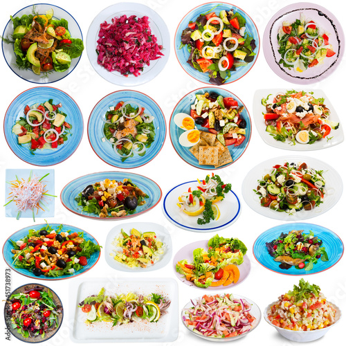 Collection of delicious homemade and restaurant salads isolated on white..